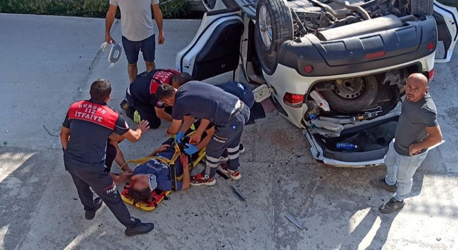 Dere yatağına düşen otomobilde anne oğul yaralandı