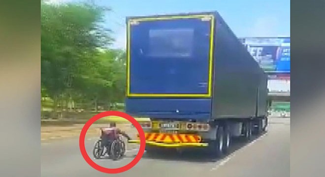 Tekerlekli sandalye ile TIR'ın arkasına takıldı